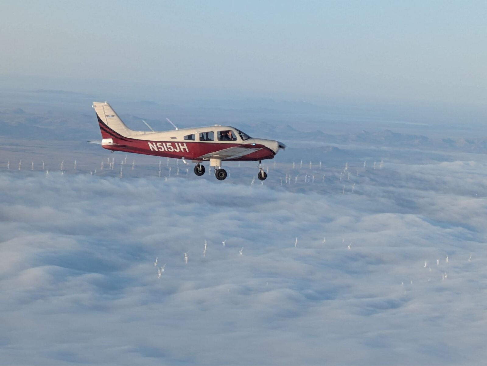 N515JH cruising above a cloud layer